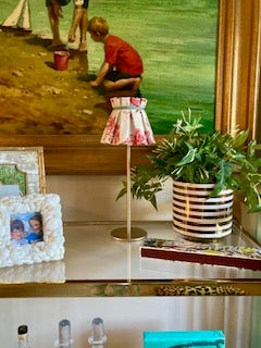 Brass colored cordless rechargable lamp with fabric lampshade