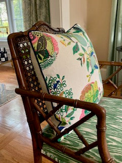 Schumacher's Citrus Garden throw pillow with navy blue piping