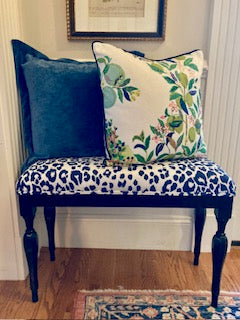 Schumacher's Citrus Garden throw pillow with navy blue piping