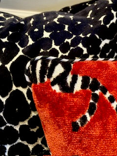 Red velvet zebra pillow with black and white piping