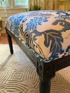 Bench upholstered with blue tiger fabric