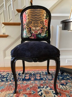 Pair of black glossy chairs upholstered with tiger fabric