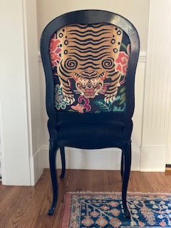 Pair of black glossy chairs upholstered with tiger fabric