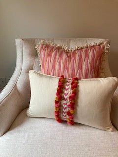 Schumacher pink and orange pillow with loopy fringe